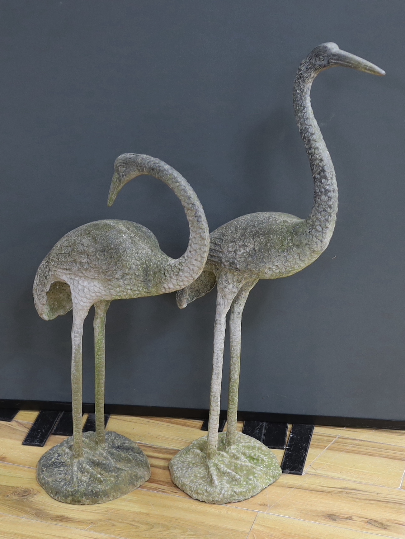 A large pair of weathered metal storks, 95cm